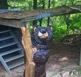 Backyard Bear in Tree side two by Kerr Chainsaw Carving